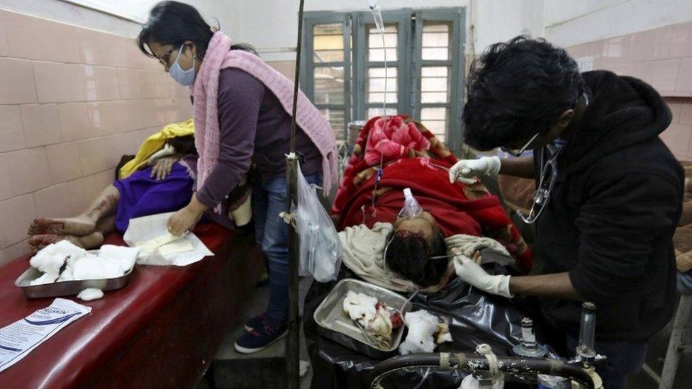 Medics tend to people who were injured after an earthquake, at a hospital in Imphal, India, January 4, 2016