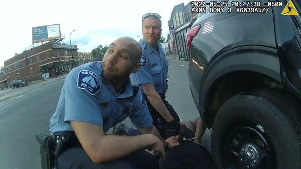 George Floyd is kneeled upon by former Minneapolis Police Department (MPD) officer Derek Chauvin next to former MPD officer J. Alexander Kueng