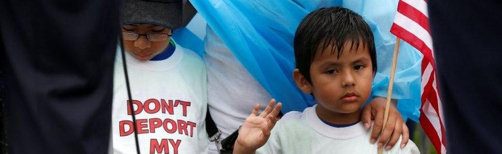 Boys wearing shirts calling for their parents not to be deported stand during a rally by immigration activists CASA and United We Dream demanding the Trump administration protect the Deferred Action for Childhood Arrivals (DACA) program and the Temporary Protection Status (TPS) programs, in Washington, U.S., August 15, 2017.