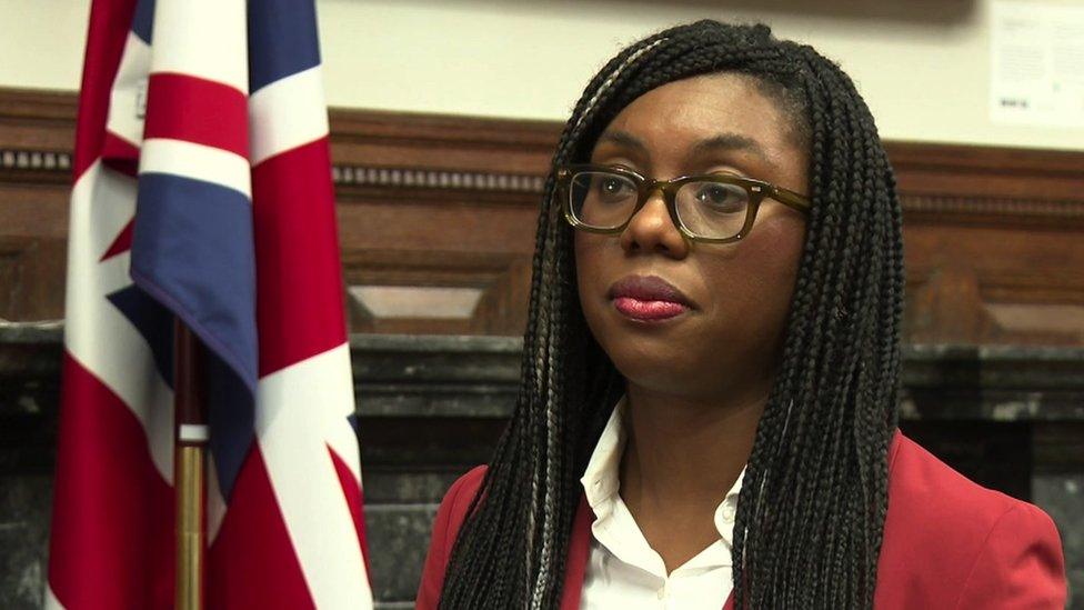 Kemi Badenoch MP looks towards the camera