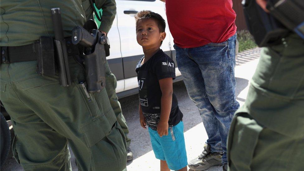 Border patrol agents detain migrants near US-Mexico border, 12 June 2018