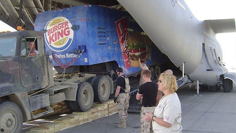 A Burger King trailer is unloaded from a C-17 Globemaster III aircraft May 19, 2004 at Bagram Airbase, Afghanistan