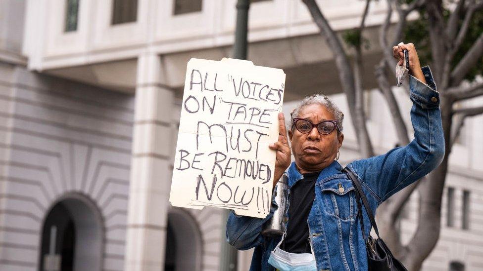 A protester calls for resignations