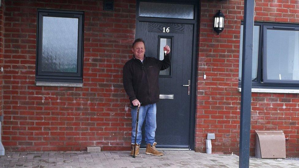 Nigel Harvey getting the keys to his home