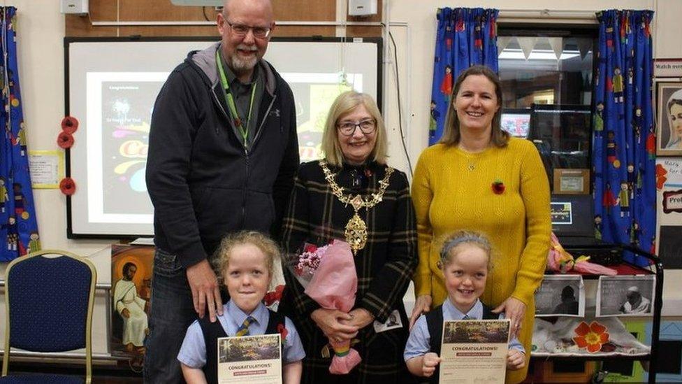 The twins and their mum and dad