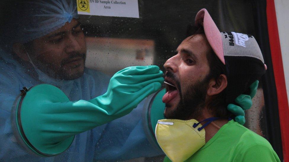 A man giving his swab for testing