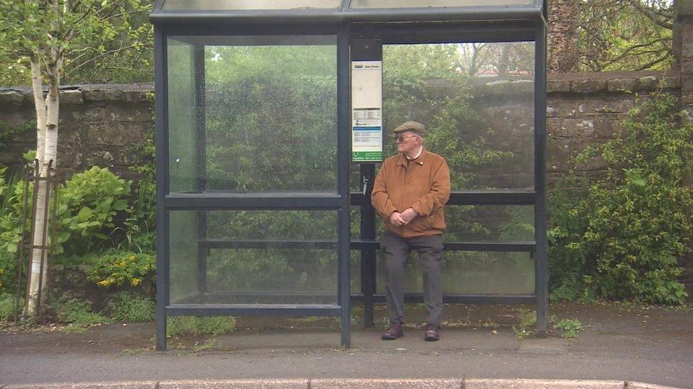 Roy Harknett at the bus stop