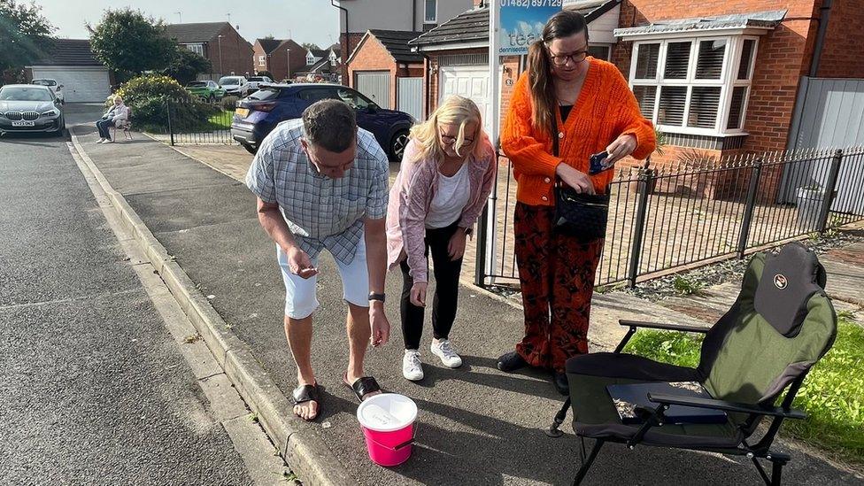 Lee Egerton makes a donation after one of several trips across Shields Road