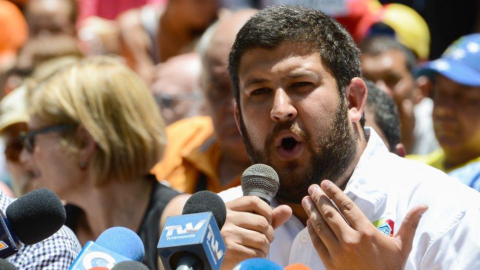 David Smolansky speaks next to other opposition mayors during a press conference at Bolivar square in the Chacao neighbourhood in Caracas, on May 25, 2017