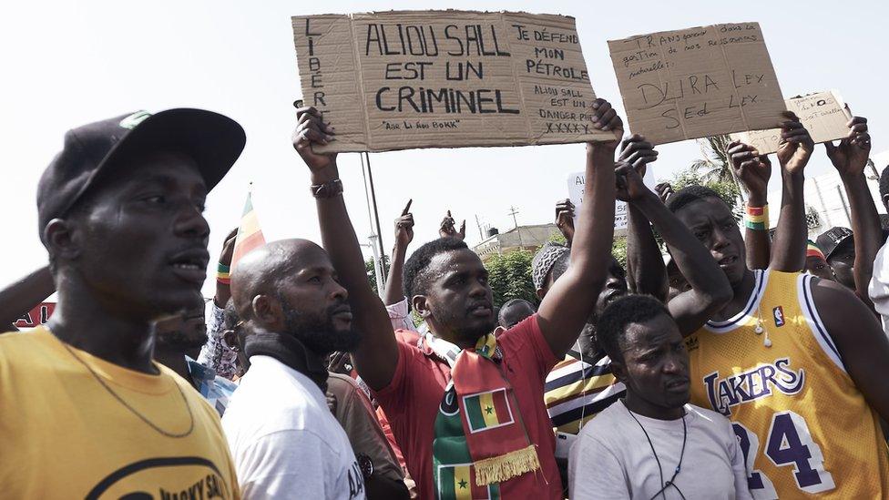 Demonstrators gather during a protest against President Macky Sall