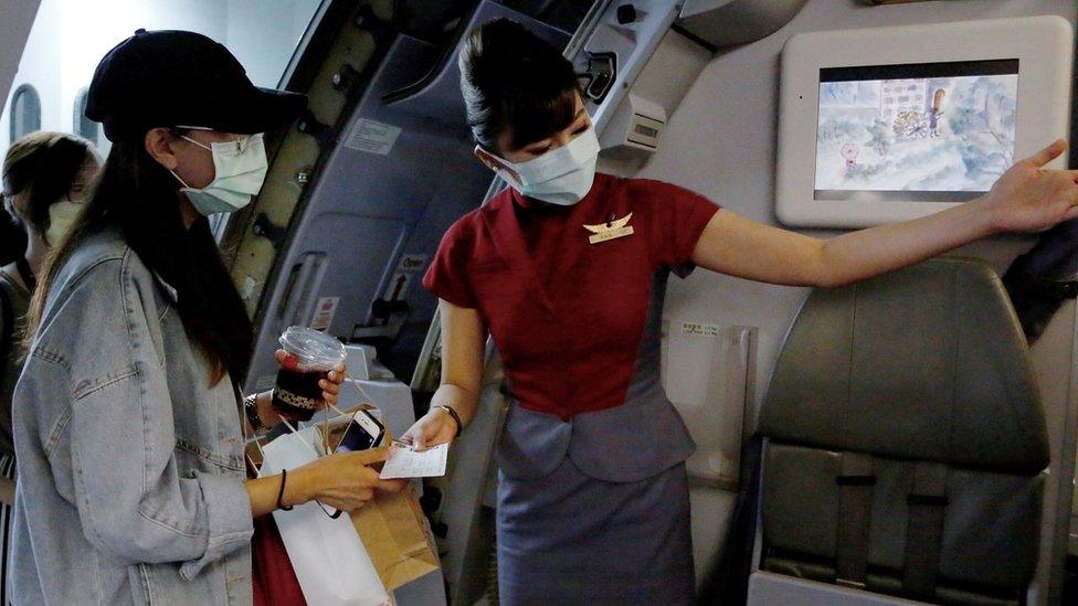 Passengers board a fake flight experience in Taiwan