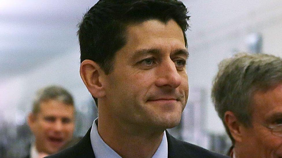 US Rep Paul Ryan is surrounded by members of the media as he leaves after a House Republican Caucus meeting