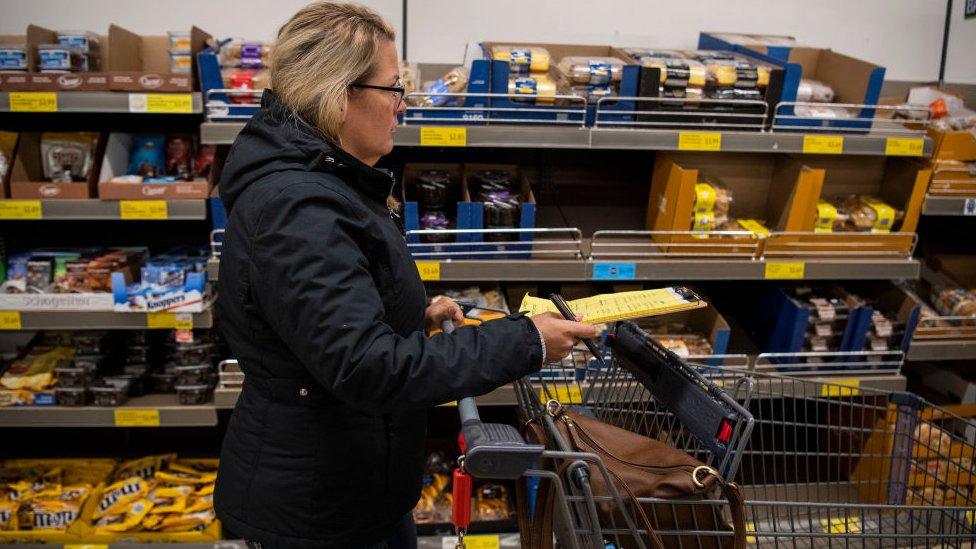 A woman shops for groceries