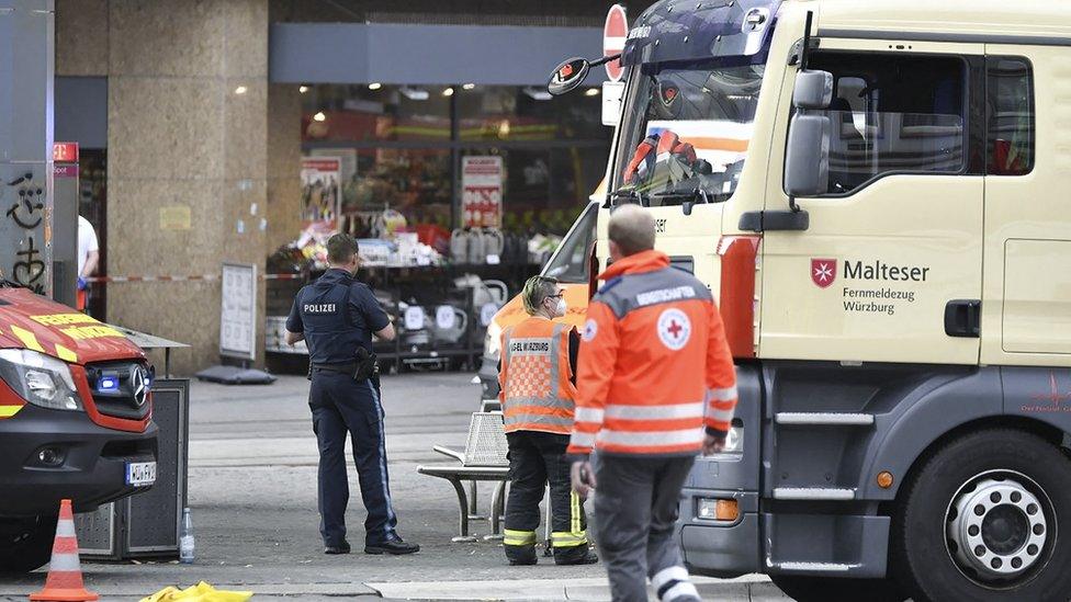 Emergency personnel is seen in the city center in Wuerzburg, southern Germany on June 25, 2021. - Several people were killed and others injured on Friday, June 25, 2021 in the southern German city of Wuerzburg