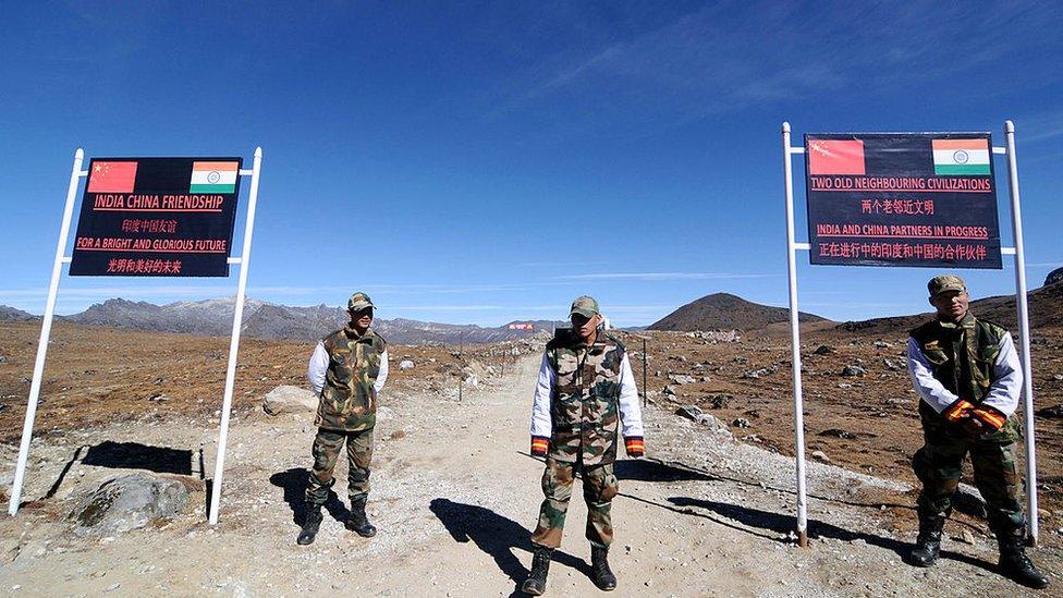 Indian Army personnel keep vigilance at Bumla pass at the India-China border in Arunachal Pradesh on October 21, 2012