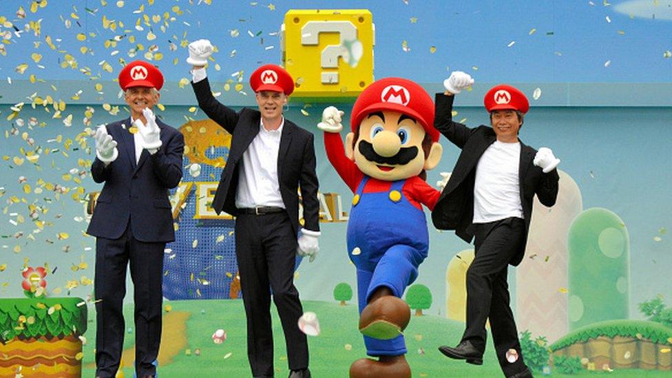 Organisers standing with Super Mario