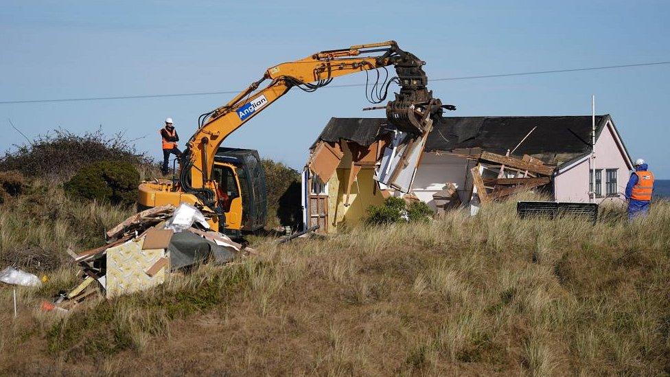 Demolition work takes place on a wooden home on The Marrams in Hemsby