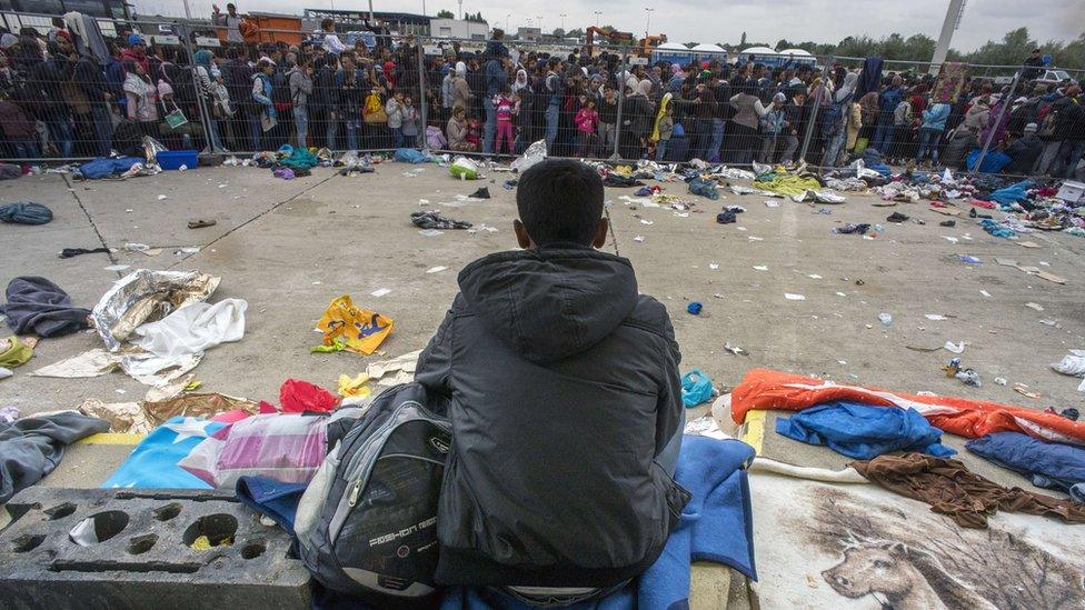 Hundreds wait for buses near Nickelsdorf, Austria on 11 September 2015