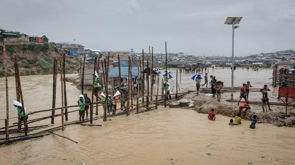 Bamboo bridge across flooded river