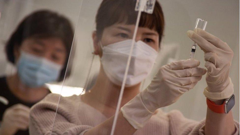 Medical workers practice during a training to give COVID-19 vaccine shots at a training facility of the Korean Nurses Association in Seoul, South Korea, 17 February 2021.