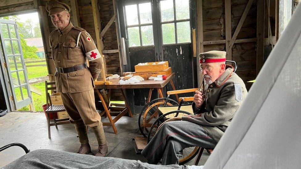 A re-enactment of a wounded soldier during an event at Kentwell Hall, Suffolk