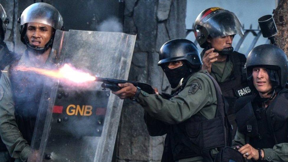 Riot police fires during a protest in Caracas. Photo: 26 July 2017