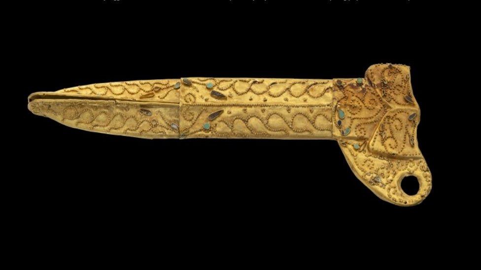 Golden dagger sheath