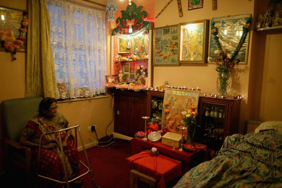 Shantaben Mistry sits inside her decorated home as she celebrates the Hindu festival of Diwali on November 11, 2015