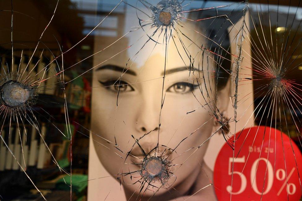 The display window of a fashion shop is severely damaged during the G20 summit in Hamburg, 7 July