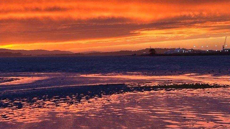 Orange sky across the water at Ashley Cross