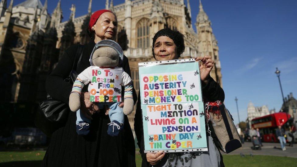 Two women protesting against proposed pension changes