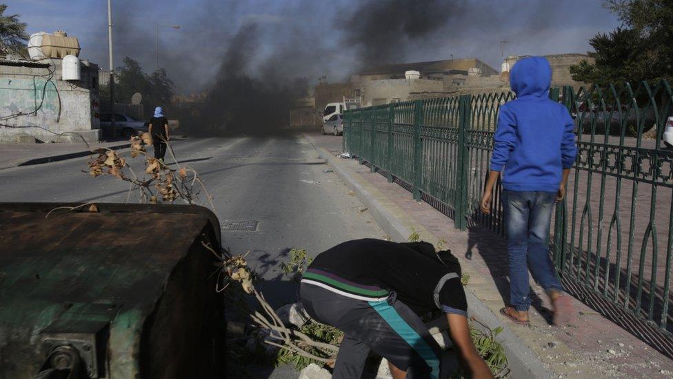 Youths in western Shia village of Karzakan, Bahrain. block streets during protests against Saudi Arabia's execution of Shia cleric. 4 Jan 2016