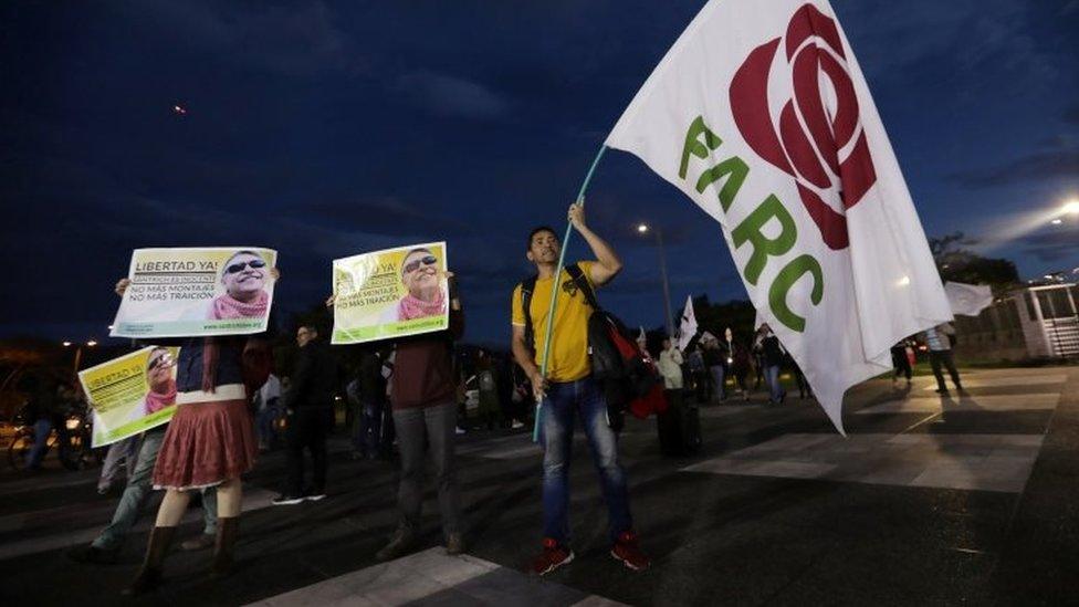 Supporters of the Revolutionary Alternative Force of the Common (FARC) protest in front of the Attorney General Office to demand the release of former FARC leader Seuxis Hernandez, known for his war alias Jesus Santrich, in Bogota, Colombia May 15, 2019