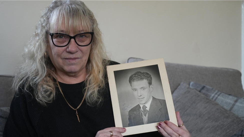 Deana Challis with photo of her father Bill Jenkins