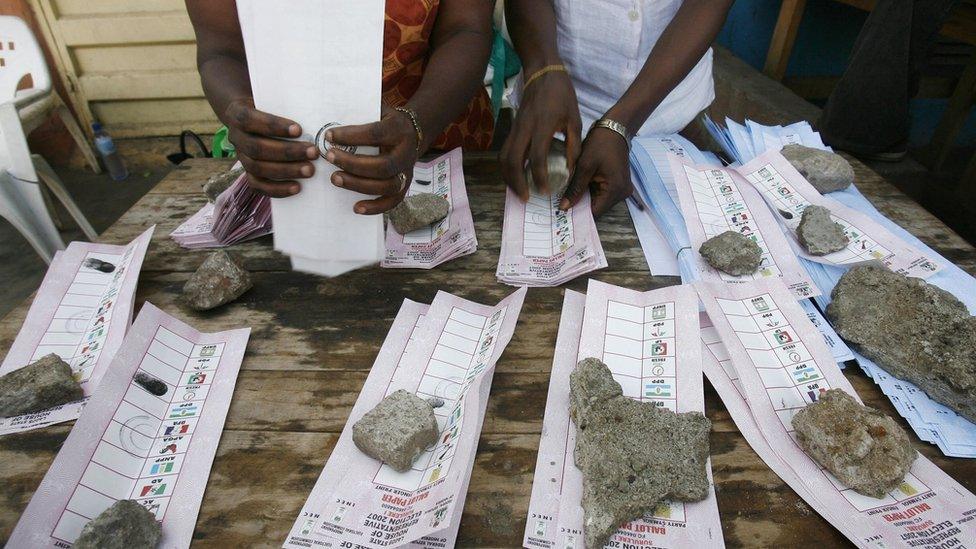 Scrutineers organise ballots papers on election day, 21 April 2007, in Lagos, Nigeria