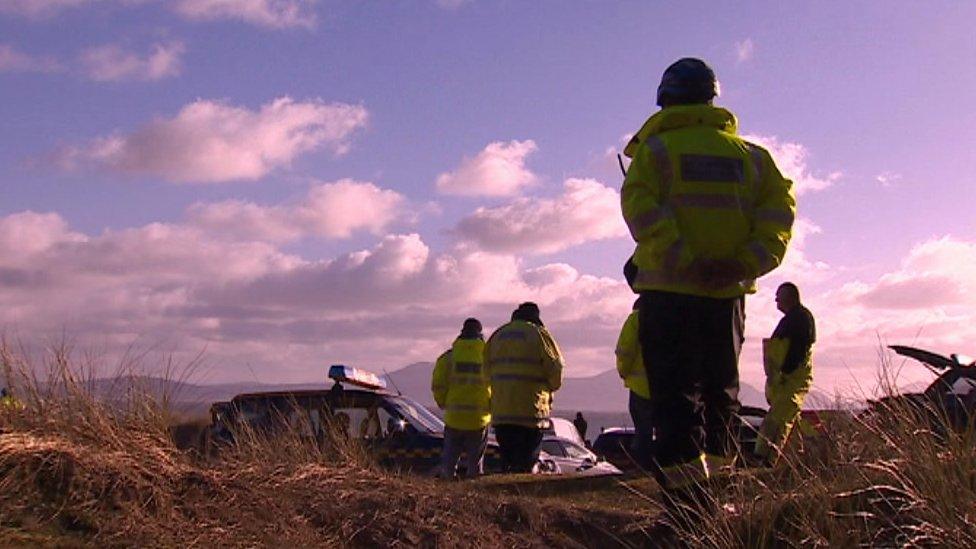 Police at Malltraeth, Anglesey, after two men's bodied were discovered