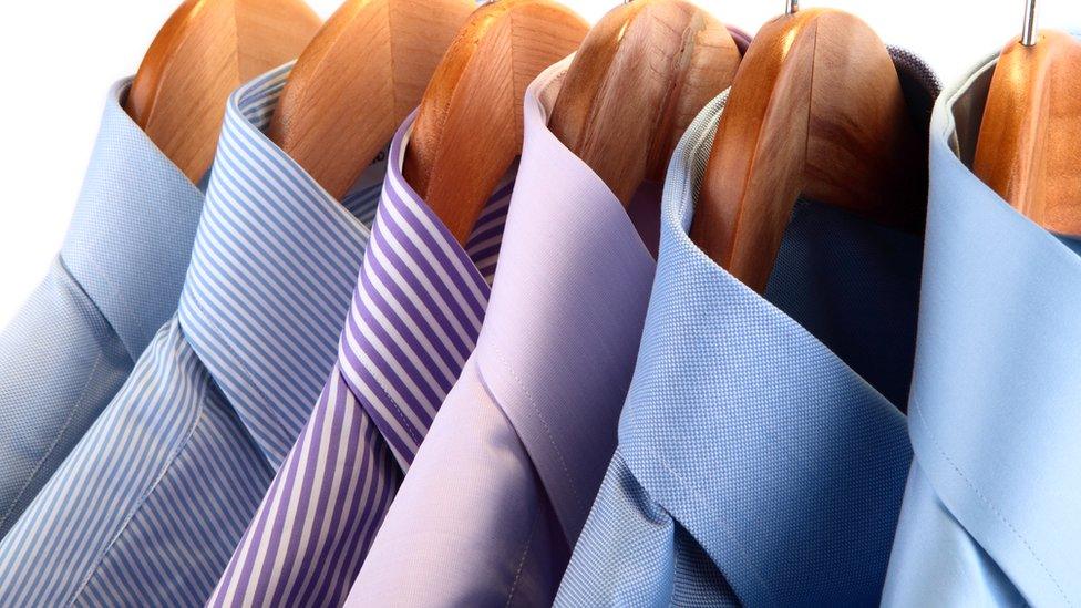 Handmade men's shirts on hangers