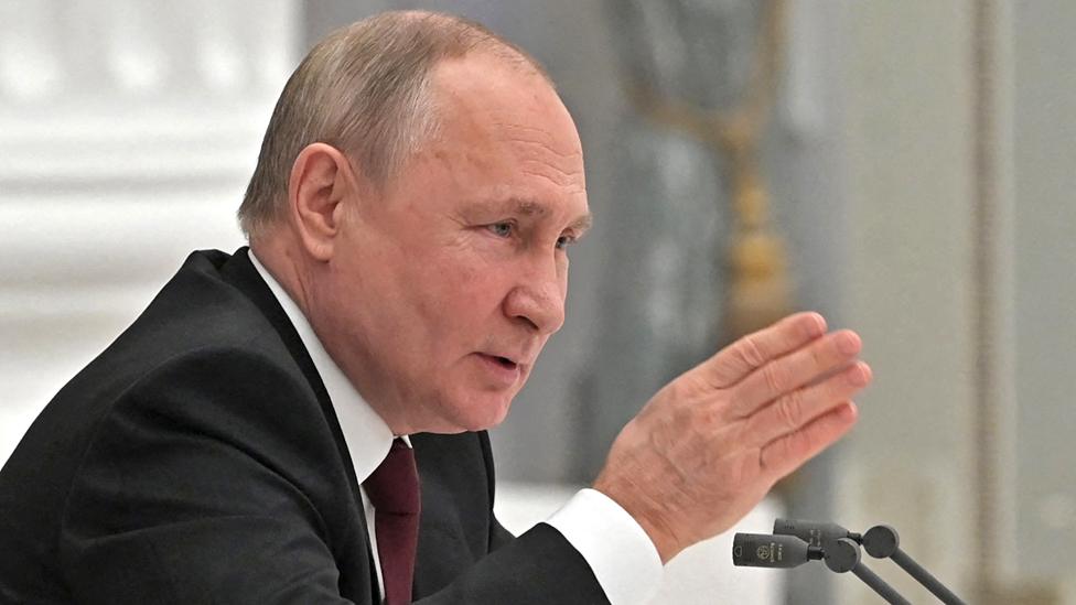 Russian President Vladimir Putin chairs a meeting with members of the Security Council in Moscow on 21 February 2022