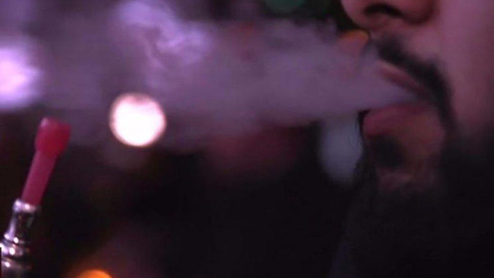 Shisha smoke being exhaled