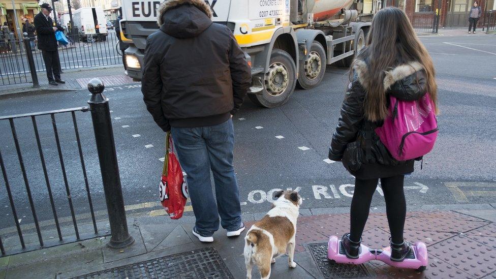 Girl going home from school on her hoverboard