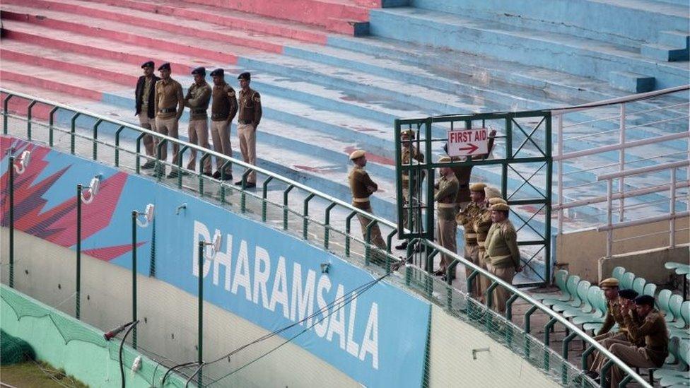 Policemen keep guard at the Himachal Pradesh Cricket Association (HPCA) stadium in Dharmsala, India, Monday, March 7, 2016.