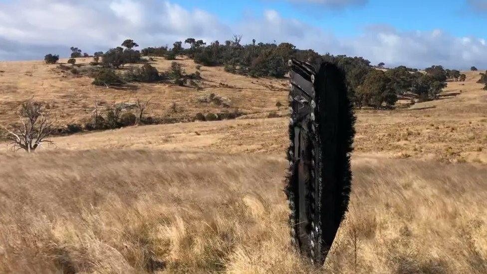 The debris from space, in the field where it was found.