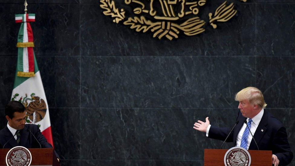 US presidential candidate Donald Trump (R) delivers a joint press conference with Mexican President Enrique Pena Nieto in Mexico City on August 31, 2016