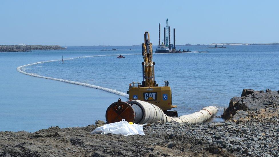 Sewage outfall pipe being laid in Belle Greve Bay, Guernsey