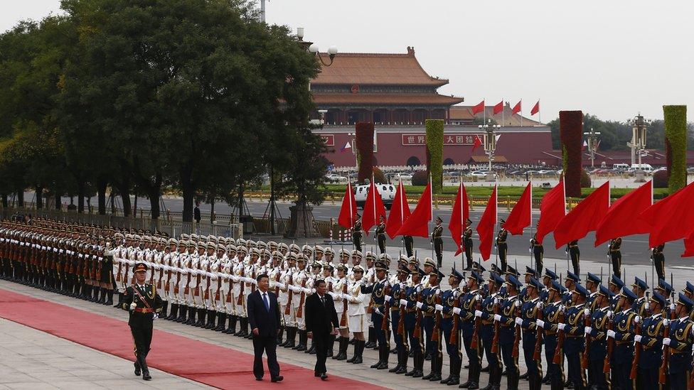 President of the Philippines Rodrigo Duterte and Chinese President Xi Jinping review the honor guard as they attend a welcoming ceremony at the Great Hall of the People on October 20, 2016