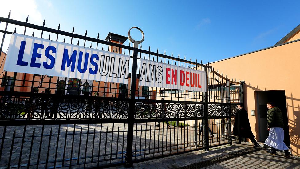 A banner displayed outside the Reims mosque after the Paris attacks reads "Muslims in mourning"