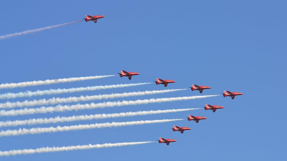 Red Arrows perform a flypast in honour of Lieutenant Governor Air Marshal Peter Walker