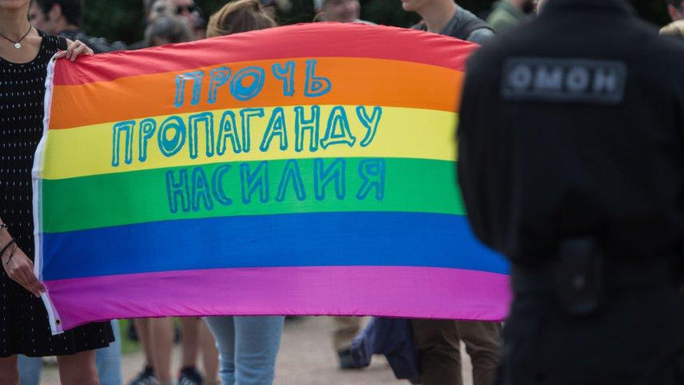 A pride flag with Russian text reading "Stop propaganda of violence"