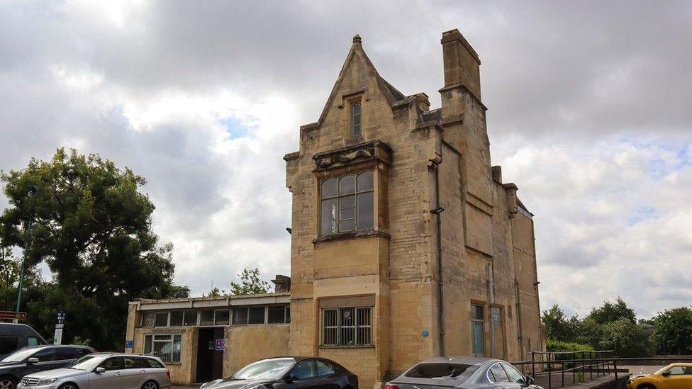 The Old Station in Cirencester with cars parked at the front