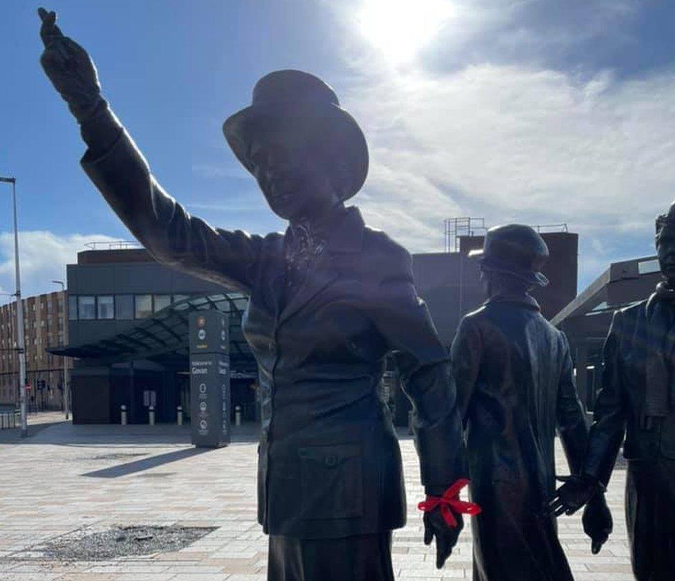 Ribbons tied to statue